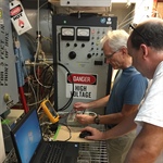 Stu Harris and Chris Smith operating the EUV Aperture Door Closer GSE